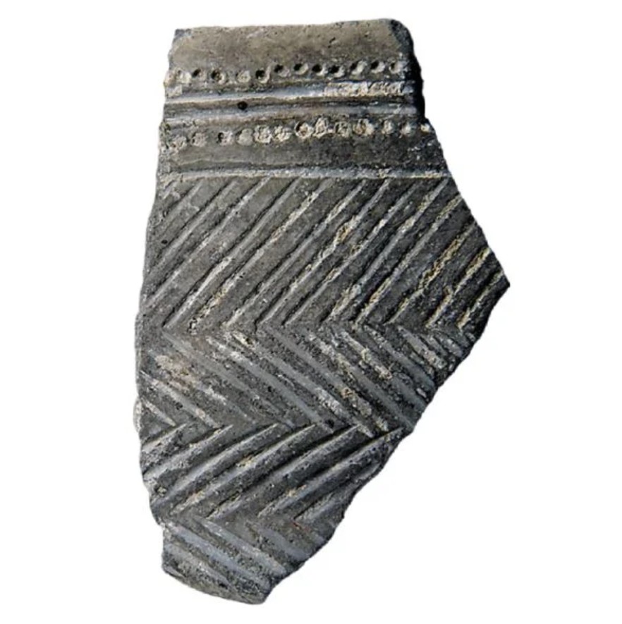 Early Neolithic ceramic sherd from Għar Dalam decorated with incised chevrons and comb-stamped motifs